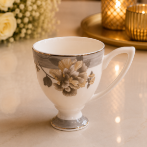Luxury white floral ceramic mug set with elegant gold rim and modern handle.